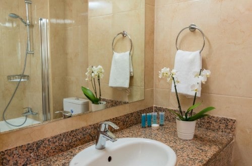 Ensuite bathroom at Ascos Coral Beach in Paphos, Cyprus. Travel with World Lifetime Journeys