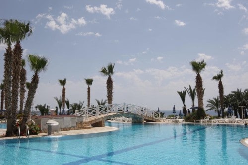 Pool view at Ascos Coral Beach in Paphos, Cyprus. Travel with World Lifetime Journeys