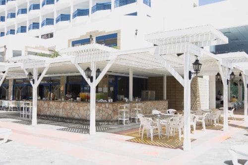 Pool bar at Ascos Coral Beach in Paphos, Cyprus. Travel with World Lifetime Journeys