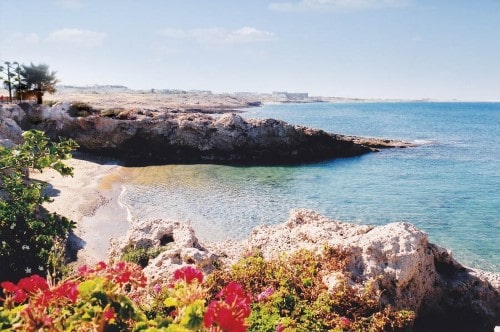 Beach area at Akti Beach Village Resort in Paphos, Cyprus. Travel with World Lifetime Journeys