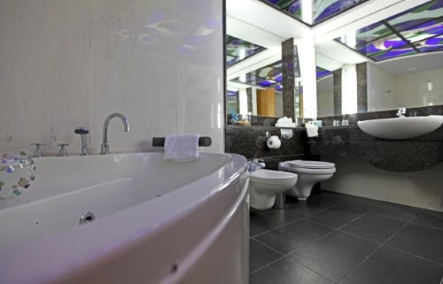 Ensuite bathroom at Poseidonia Beach Hotel in Limassol, Cyprus. Travel with World Lifetime Journeys