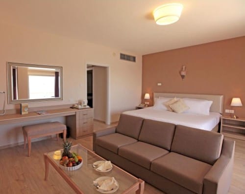 Double bedroom at Poseidonia Beach Hotel in Limassol, Cyprus. Travel with World Lifetime Journeys