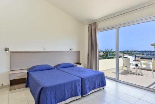 Double room with balcony at Makronisos Holiday Village in Ayia Napa, Cyprus. Travel with World Lifetime Journeys