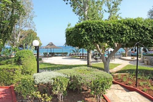 Garden view at Poseidonia Beach Hotel in Limassol, Cyprus. Travel with World Lifetime Journeys