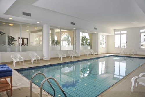 Indoor pool at Akti Beach Village Resort in Paphos, Cyprus. Travel with World Lifetime Journeys