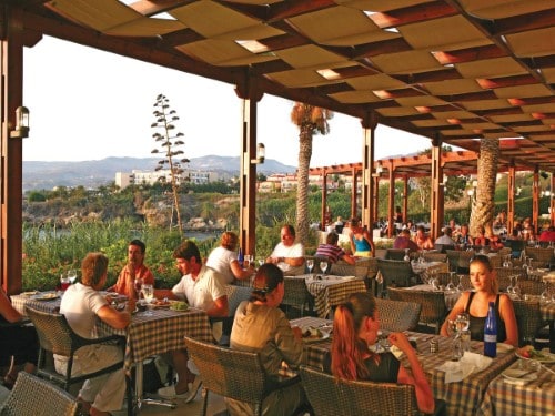 Outdoor terrace at Cynthiana Beach Hotel in Paphos, Cyprus. Travel with World Lifetime Journeys