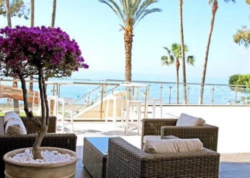 Outside terrace at Poseidonia Beach Hotel in Limassol, Cyprus. Travel with World Lifetime Journeys