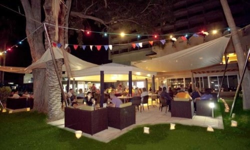 Outside bar area at Poseidonia Beach Hotel in Limassol, Cyprus. Travel with World Lifetime Journeys