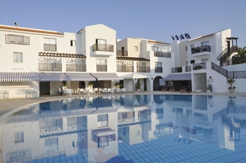 Pool view at Akti Beach Village Resort in Paphos, Cyprus. Travel with World Lifetime Journeys