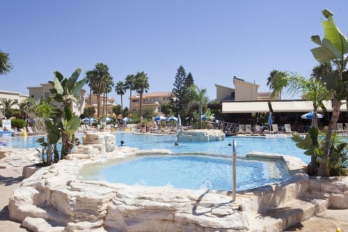 Pool side at Makronisos Holiday Village in Ayia Napa, Cyprus. Travel with World Lifetime Journeys