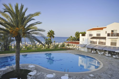 Pool view at Akti Beach Village Resort in Paphos, Cyprus. Travel with World Lifetime Journeys