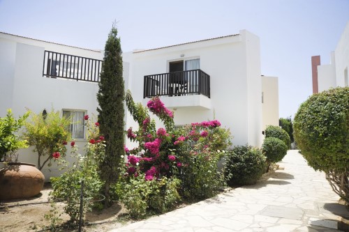 Walking path at Akti Beach Village Resort in Paphos, Cyprus. Travel with World Lifetime Journeys