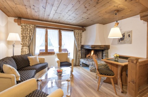 Aparment with fireplace at Hotel Steinbock in Klosters, Switzerland. Travel with World Lifetime Journeys