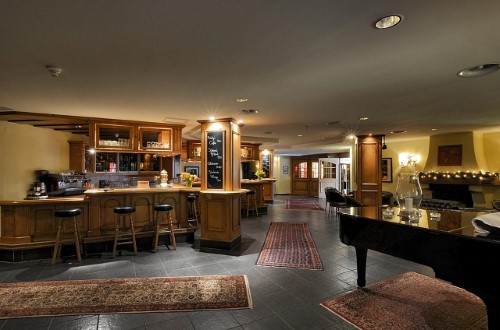 Bar area at Silvretta Parkhotel in Klosters, Switzerland. Travel with World Lifetime Journeys