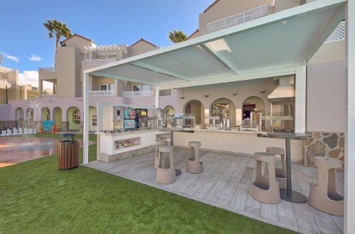 Pool bar at The Koala Garden Suites in Maspalomas, Gran Canaria. Travel with World Lifetime Journeys