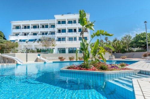 Beautiful pool side at Sentido Acacia Marina in South Sicily, Italy. Travel with World Lifetime Journeys