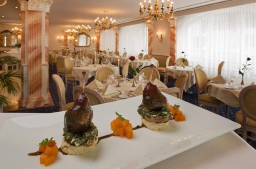 Beautiful restaurant at Hotel Schweizerhof Gourmet and Spa in Saas Fee, Switzerland. Travel with World Lifetime Journeys