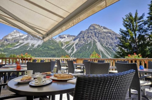 Beautiful terrace view at Sorell Hotel Asora in Arosa, Switzerland. Travel with World Lifetime Journeys