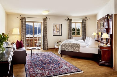 Colourful double room at Schloss Mittersill Hotel in Kitzbühel, Austria. Travel with World Lifetime Journeys