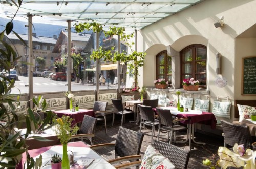 Covered terrace at Hotel Zum Hirschen in Zell am See, Austria. Travel with World Lifetime Journeys