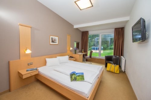 Double room at Alpine Resort Zell am See in Austria. Travel with World Lifetime Journeys