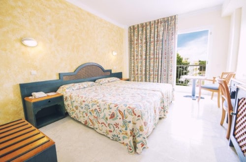 Double room at Azuline Hotel Coral Beach in Es Canar, Ibiza. Travel with World Lifetime Journeys