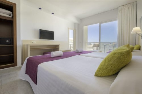 Double room at Azuline Hotel Coral Beach in Es Canar, Ibiza. Travel with World Lifetime Journeys