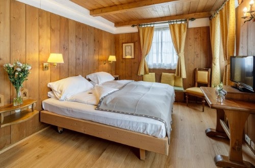 Double room at Chalet Hotel Parc Victoria in Cortina D’Ampezzo, Italy. Travel with World Lifetime Journeys