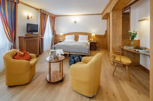 Double room at Chalet Hotel Parc Victoria in Cortina D’Ampezzo, Italy. Travel with World Lifetime Journeys