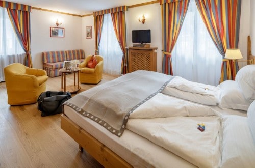 Double room at Chalet Hotel Parc Victoria in Cortina D’Ampezzo, Italy. Travel with World Lifetime Journeys