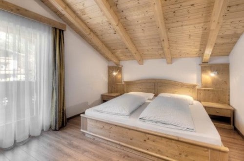 Double room at Garni Bracun Hotel in Corvara, Italy. Travel with World Lifetime Journeys