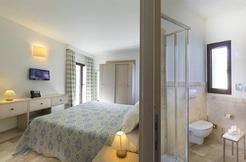 Double room at Grand Baia Resort in San Teodoro, Sardinia. Travel with World Lifetime Journeys