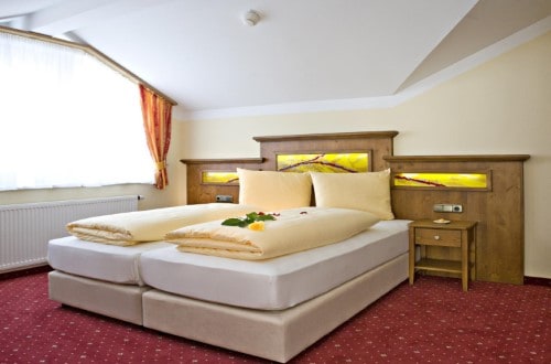 Double room at Hotel Feinschmeck in Zell am See, Austria. Travel with World Lifetime Journeys