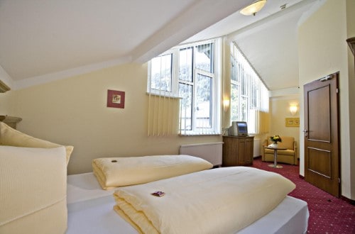 Double room at Hotel Feinschmeck in Zell am See, Austria. Travel with World Lifetime Journeys