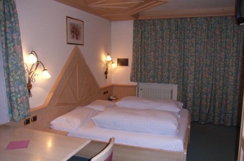 Double room at Hotel Olympia in Arabba, Italy. Travel with World Lifetime Journeys