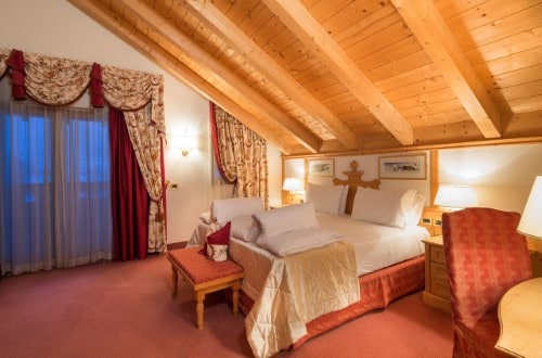 Double room at Hotel Sassongher in Corvara, Italy. Travel with World Lifetime Journeys