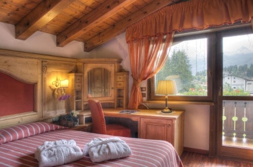 Double room at Sport Hotel Barisetti in Cortina D’Ampezzo, Italy. Travel with World Lifetime Journeys