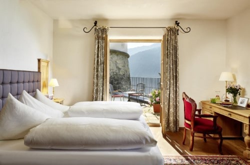 Double room with balcony at Schloss Mittersill Hotel in Kitzbühel, Austria. Travel with World Lifetime Journeys