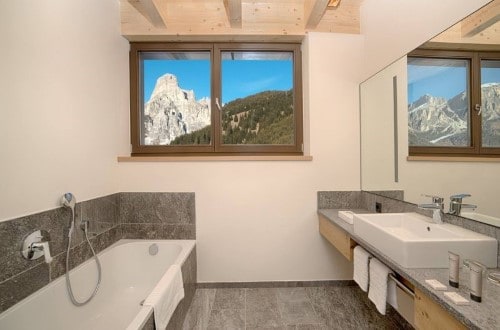 Ensuie bath at Sporthotel Panorama in Corvara, Italy. Travel with World Lifetime Journeys