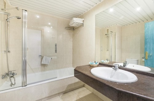 Ensuite bath at Hotel Los Patos Park in Benalmadena, Spain. Travel with World Lifetime Journeys