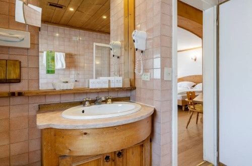 Ensuite bath at Chalet Hotel Parc Victoria in Cortina D’Ampezzo, Italy. Travel with World Lifetime Journeys