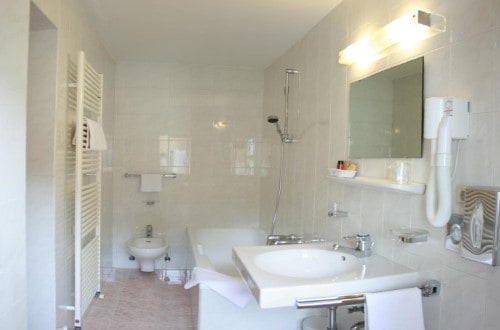 Ensuite bath at Hotel Dolomiti Madonna in Ortisei, Italy. Travel with World Lifetime Journeys