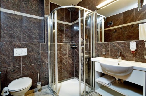 Ensuite bath at Hotel Fischerwirt in Zell am See, Austria. Travel with World Lifetime Journeys