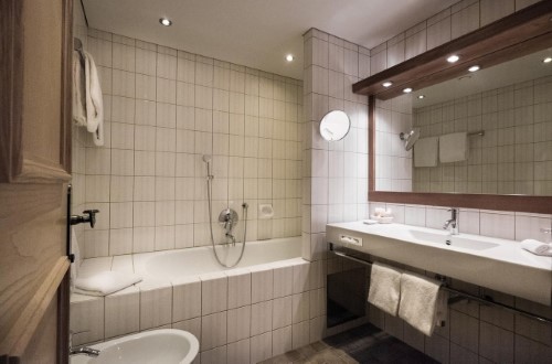 Ensuite bath at Hotel Schwarzer Adler in Kitzbühel, Austria. Travel with World Lifetime Journeys