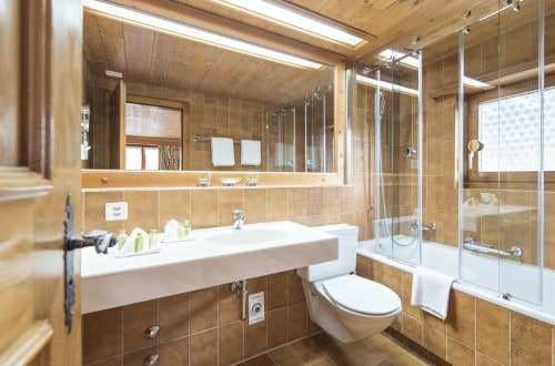 Ensuite bath at Hotel Steinbock in Klosters, Switzerland. Travel with World Lifetime Journeys