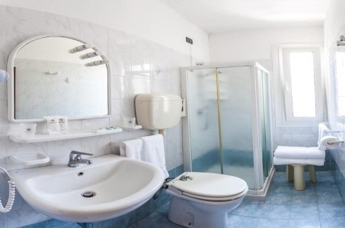 Ensuite bathroom at Hotel Christian in Lido di Jesolo, Italy. Travel with World Lifetime Journeys