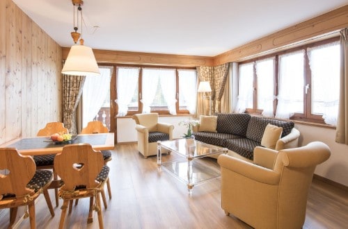 Family apartment with balcony at Hotel Steinbock in Klosters, Switzerland. Travel with World Lifetime Journeys