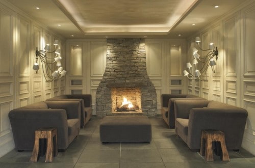 Fireplace area at Hotel Schwarzer Adler in Kitzbühel, Austria. Travel with World Lifetime Journeys