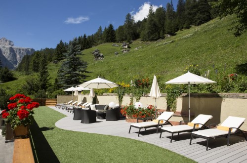 Garden view at Hotel Sassongher in Corvara, Italy. Travel with World Lifetime Journeys