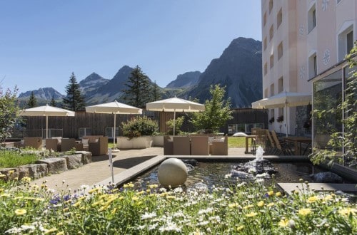 Garden view at Hotel Sunstar Arosa, Switzerland. Travel with World Lifetime Journeys